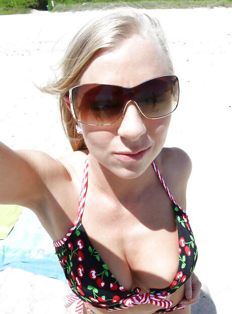 Very attractive american milf Britney Brooks revealing big boobs and undressing on the beach